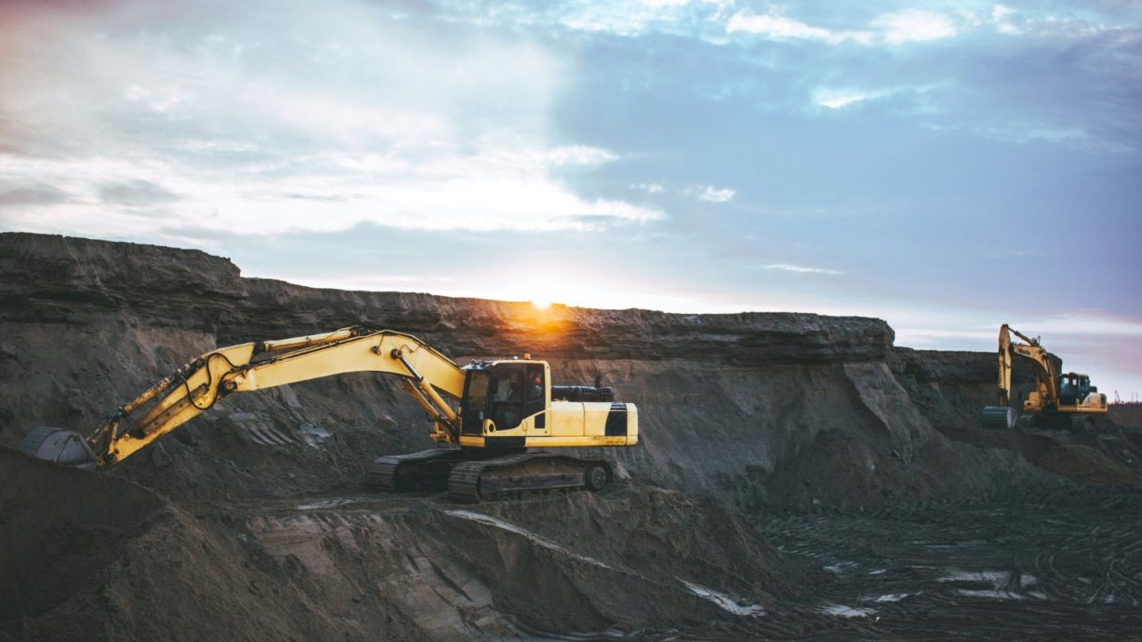 Open-pit mining operations at sunset